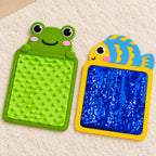 Fish sequin mat and frog bumpy texture mat on an ivory rug