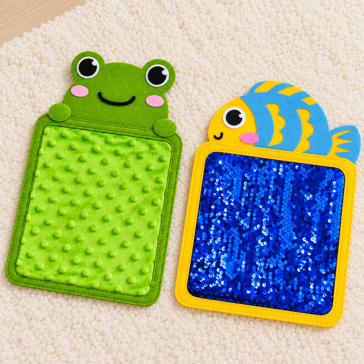 Fish sequin mat and frog bumpy texture mat on an ivory rug