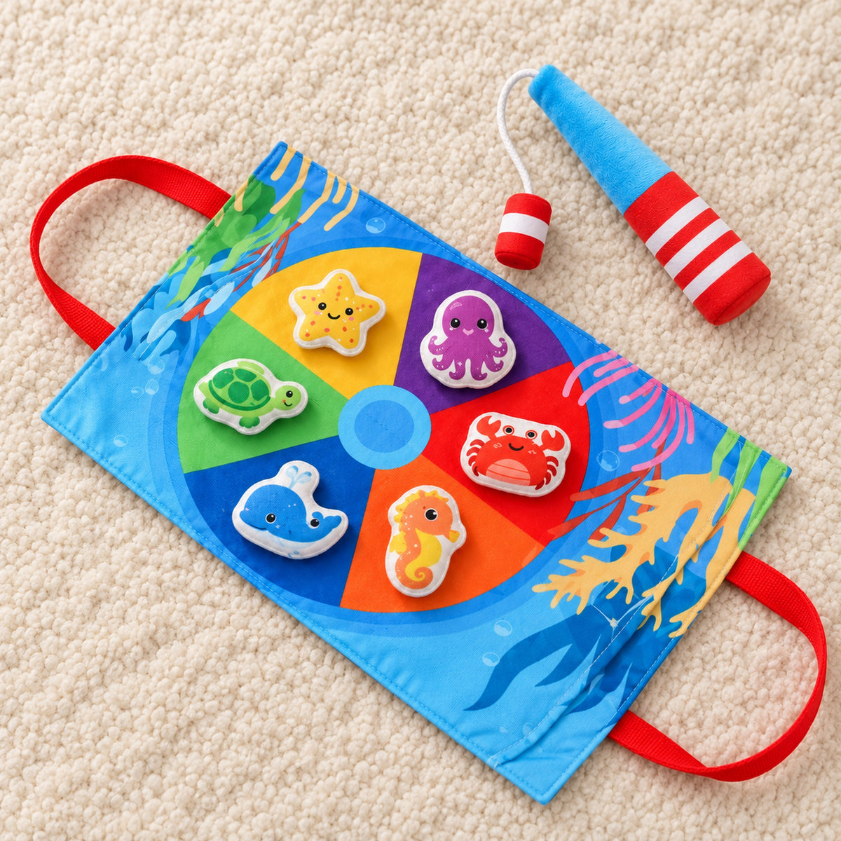 Mini fishing set arranged on an ivory playroom rug