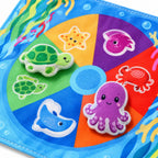 Close-up of printed turtle and octopus fabric pieces and stitched edges
