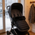Lumiwee Mitten stroller bunting bag: black stroller footmuff fitted in an empty stroller by the door