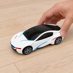 Adult hand setting the closed robot-car toy on the floor