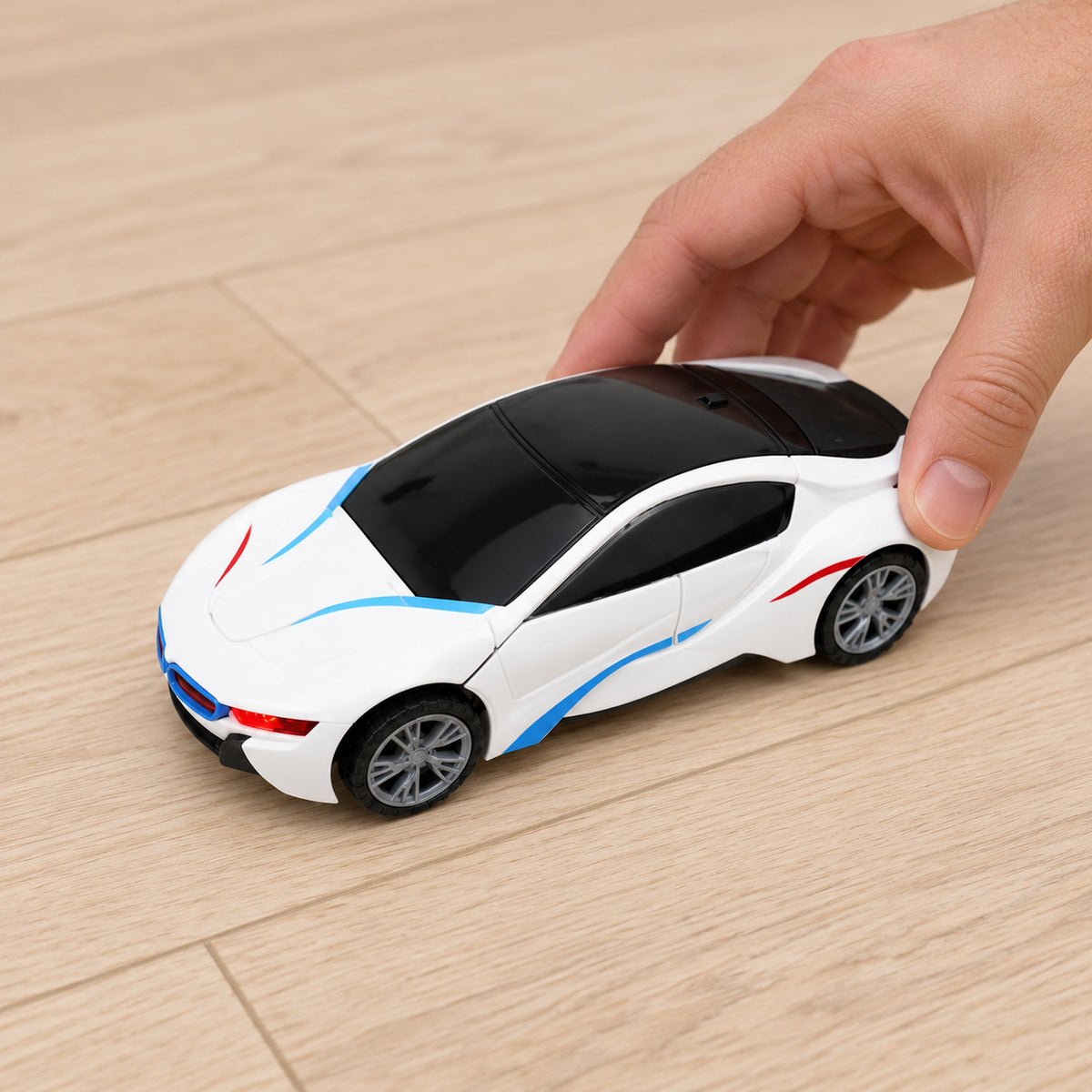 Adult hand setting the closed robot-car toy on the floor