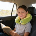 Lumiwee Nap U-shaped memory foam travel pillow: child wearing the avocado neck pillow on a car ride