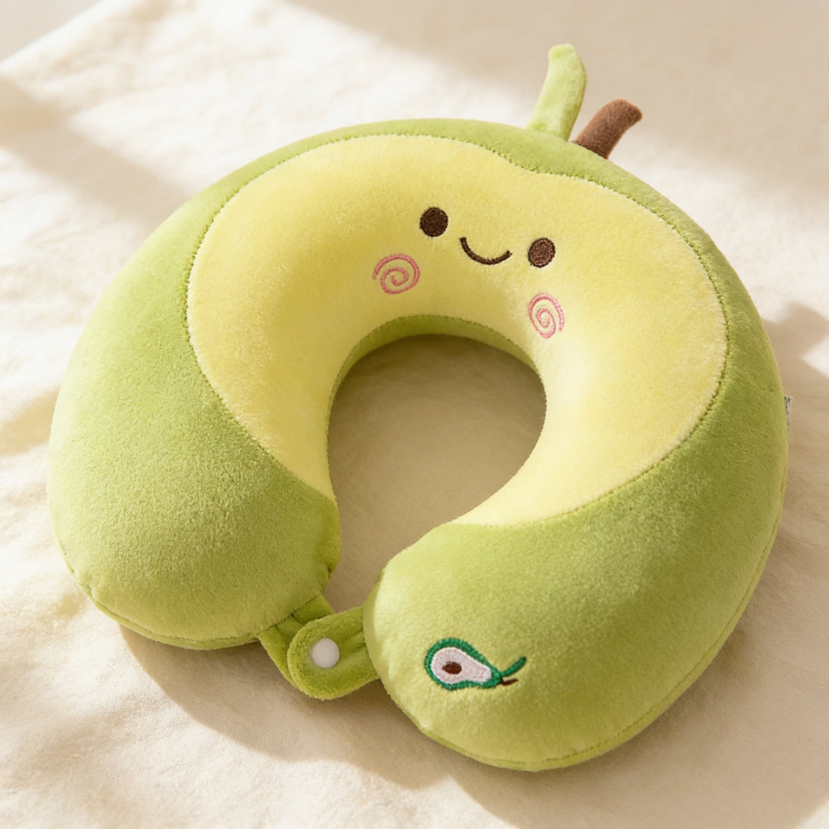 Lumiwee Nap U-shaped memory foam travel pillow: close-up of the plush face, embroidery and snap strap