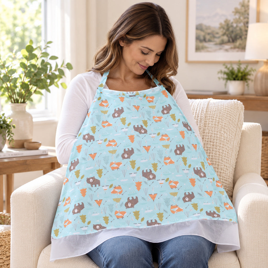 Adult wearing the Bear-print nursing cover while seated in a bright living room