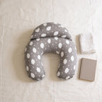Lumiwee Nursing pillow with adjustable strap: the nursing pillow next to a book for scale