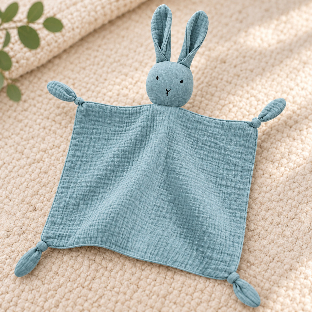 Close-up of the blue bunny lovey's muslin fabric and tied corner