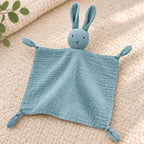 Close-up of the blue bunny lovey's muslin fabric and tied corner