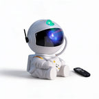 Lumiwee Orbit astronaut star projector: white astronaut star projector with remote on a white background