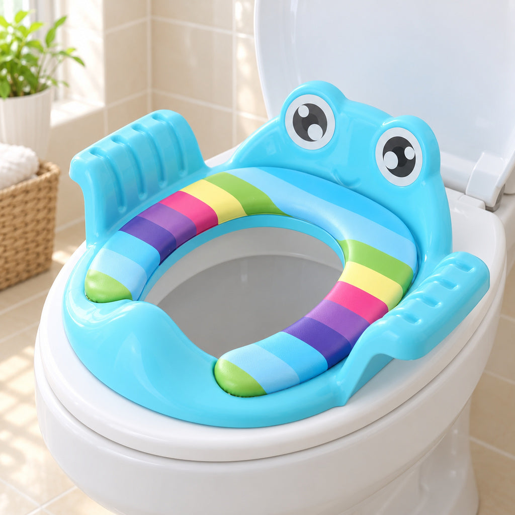 Blue padded potty training seat fitted on a white toilet in a bright bathroom