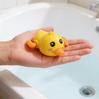 Lumiwee Paddle wind-up bath toy: the duck toy on an open palm for scale