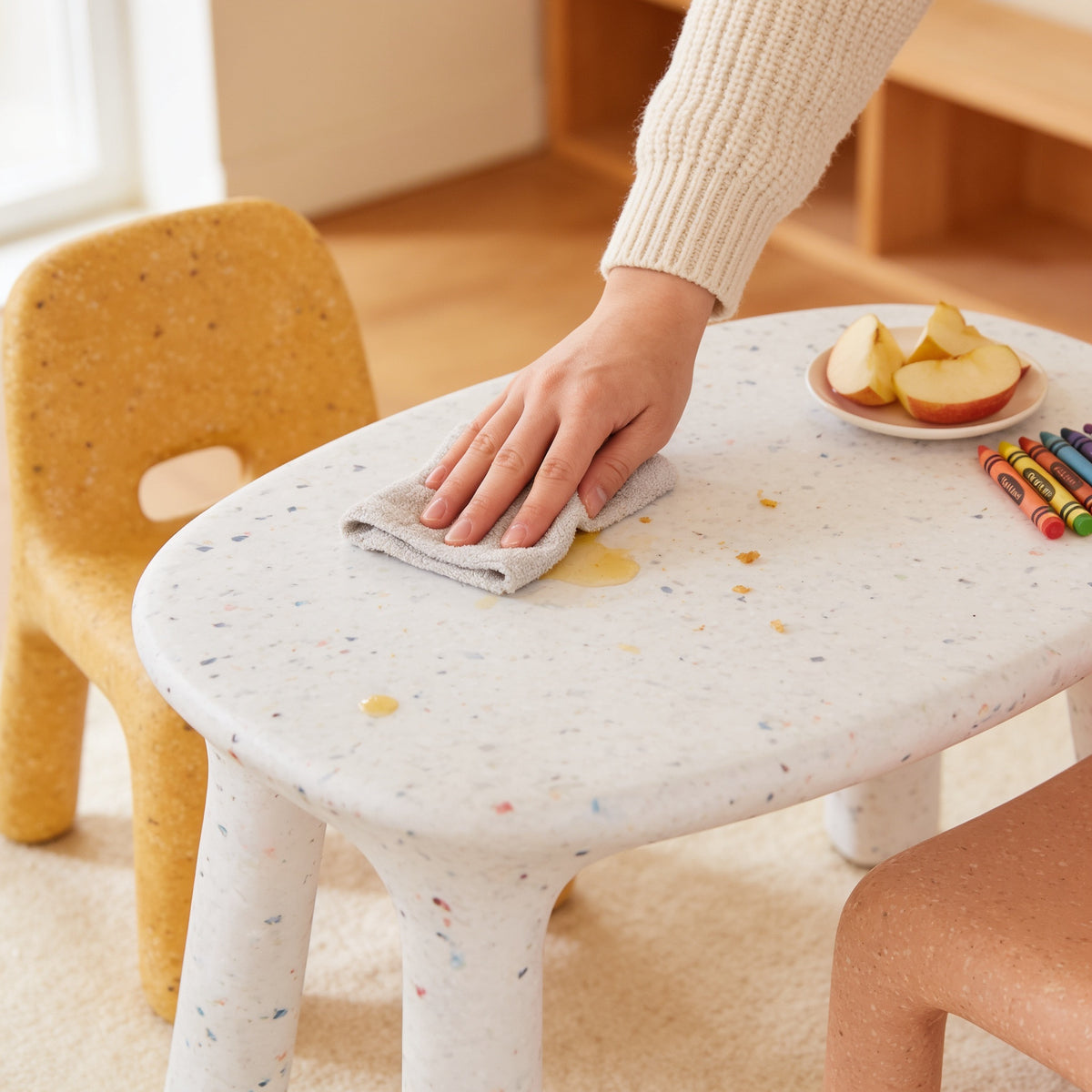 Lumiwee Pebble kids table and chair set: wiping the smooth table top clean with a damp cloth
