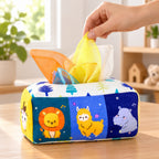 Adult hand holding a yellow scarf at the Animals toy tissue box opening