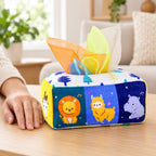 Animals tissue box toy beside an adult hand for scale