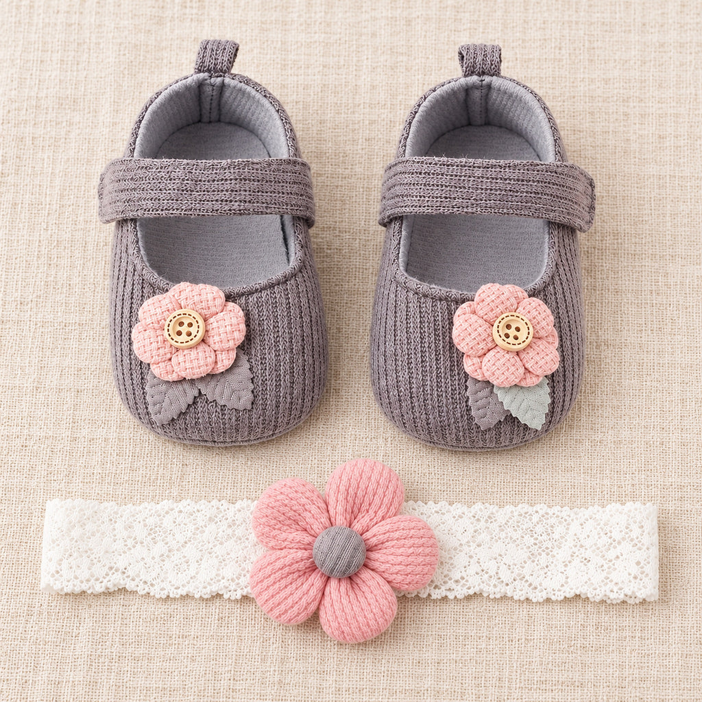 Gray button-flower shoe set with one matching headband laid flat