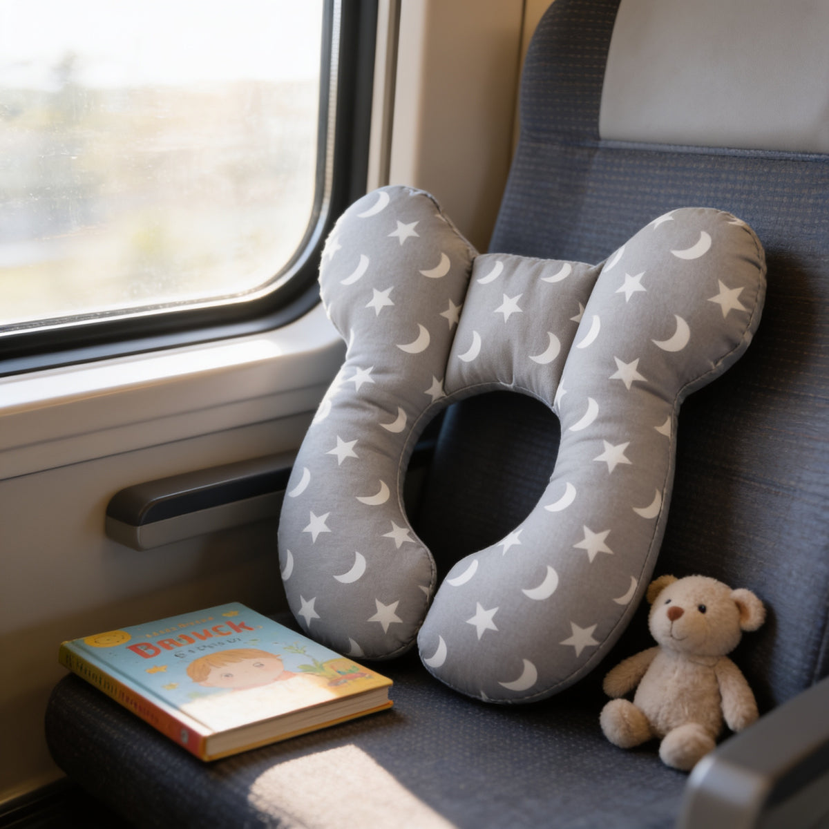 Lumiwee Pip toddler U-shaped travel pillow, Star and Moon option, in a bright room