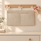 Adult tying the organizer to a wooden wall rail