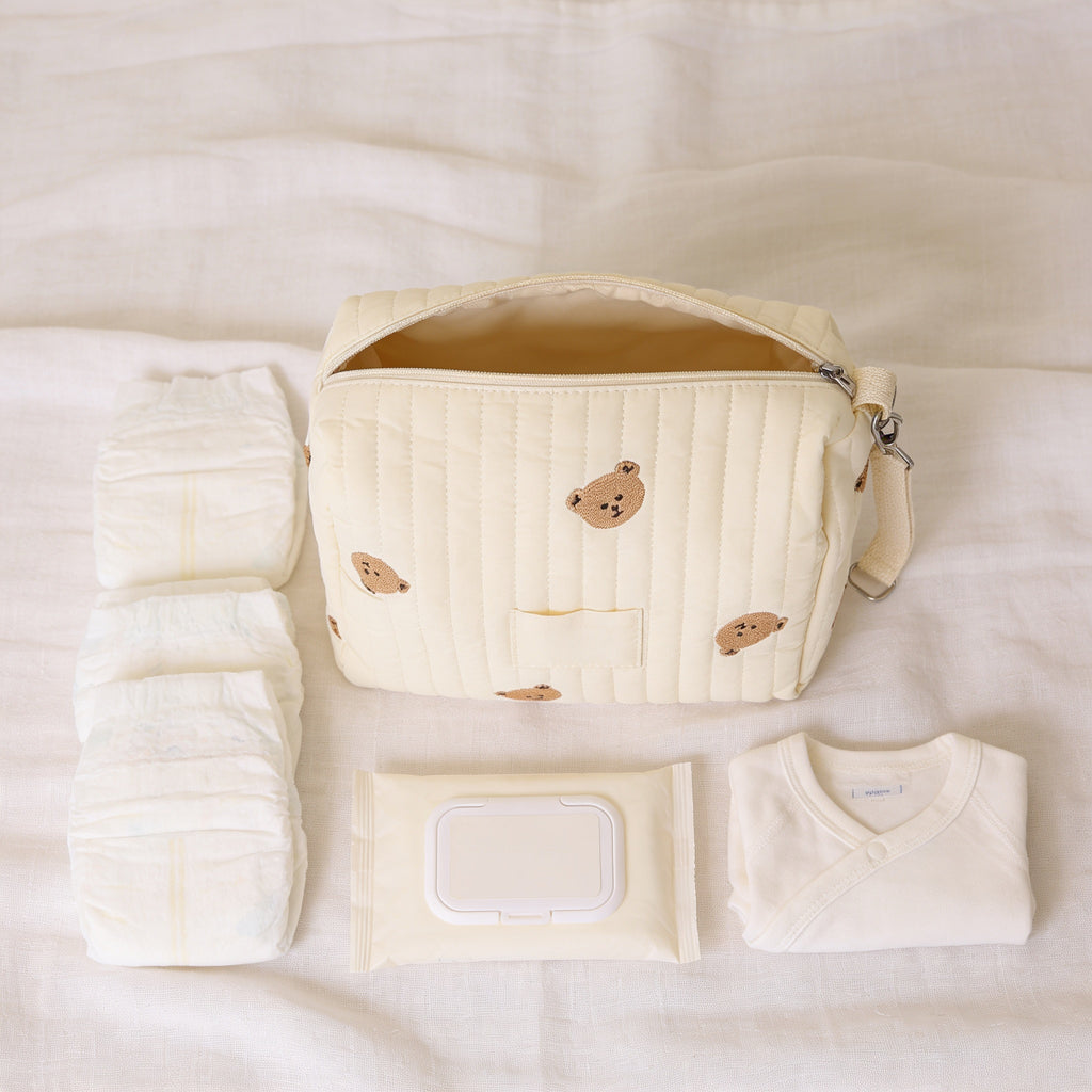 Lumiwee Posy embroidered diaper pouch: what fits: diapers, wipes and a spare onesie beside the pouch