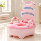 Pink potty chair with open lid in a clean neutral bathroom