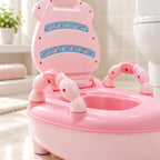 Close-up of the pink potty chair side handle and seat