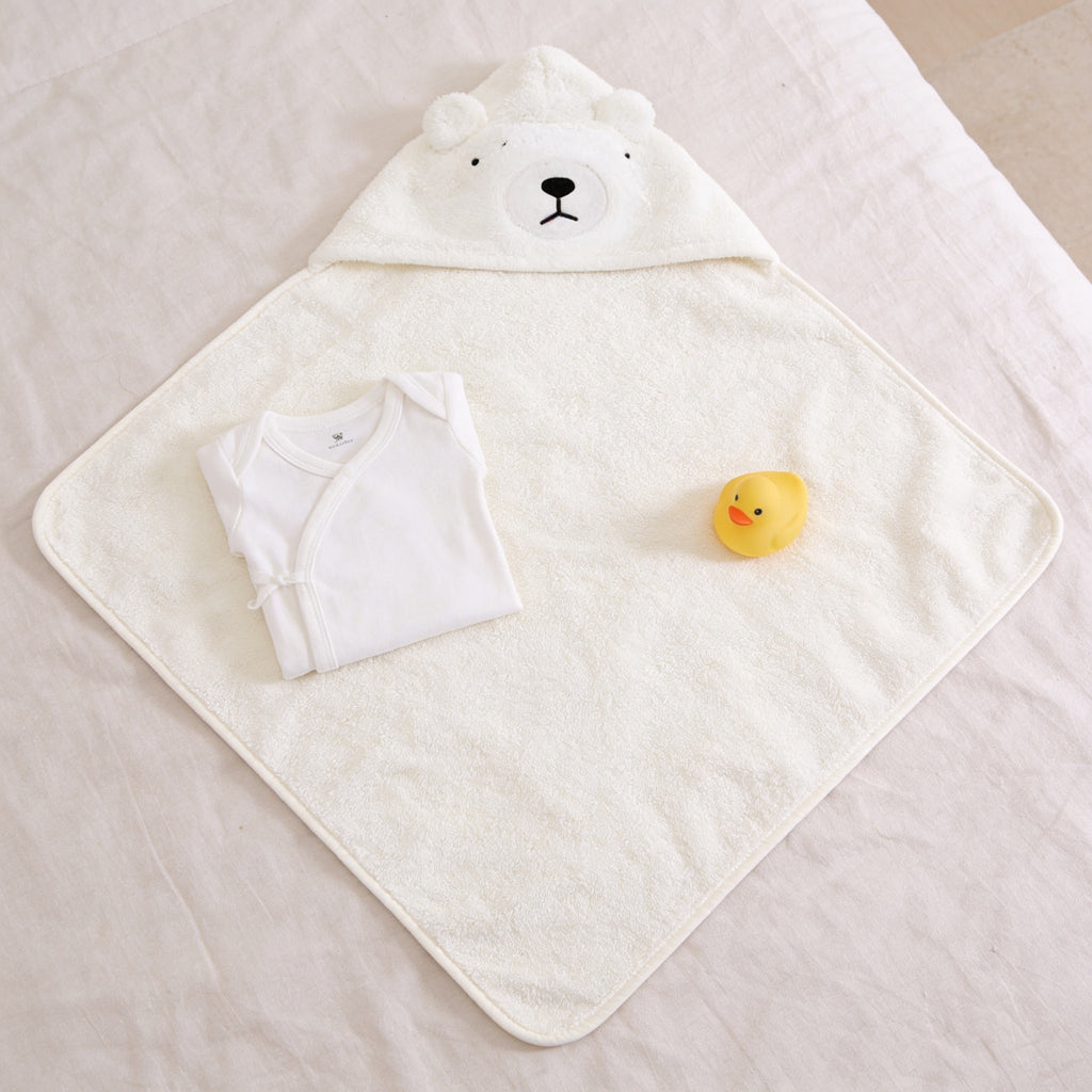 Lumiwee Puddle hooded baby bath towel: the towel laid open with a onesie for scale