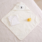 Lumiwee Puddle hooded baby bath towel: the towel laid open with a onesie for scale