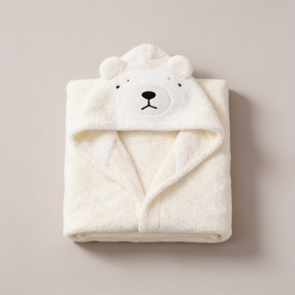 Lumiwee Puddle hooded baby bath towel: cream polar bear hooded baby towel on a plain background
