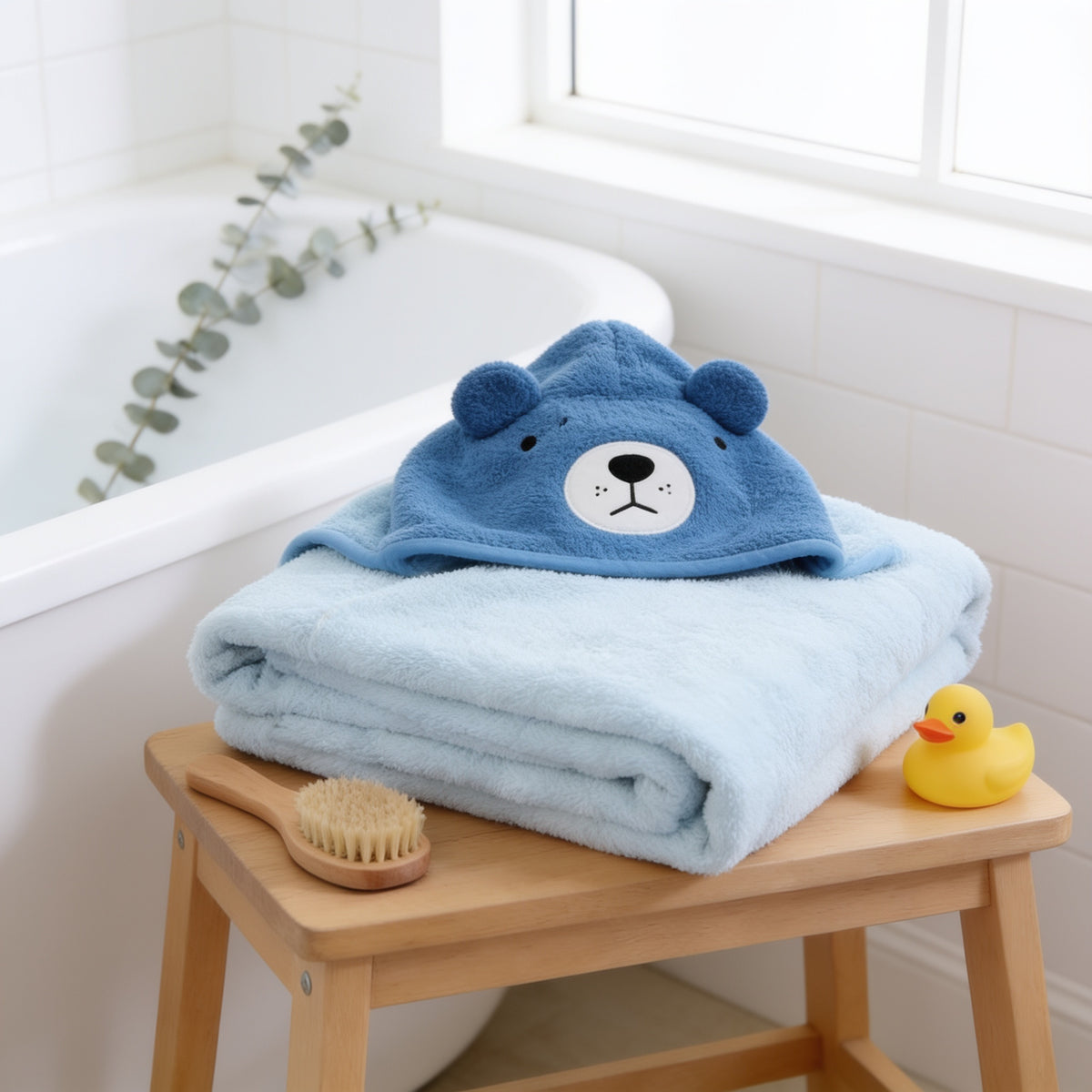 Lumiwee Puddle hooded baby bath towel, Blue Bear option, in a bright room