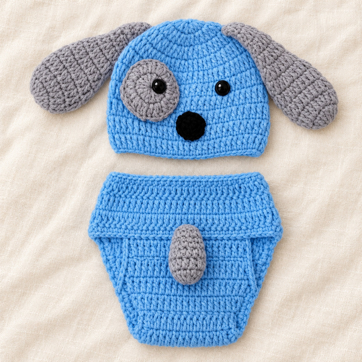 Puppy hat with the diaper cover turned to show its gray tail