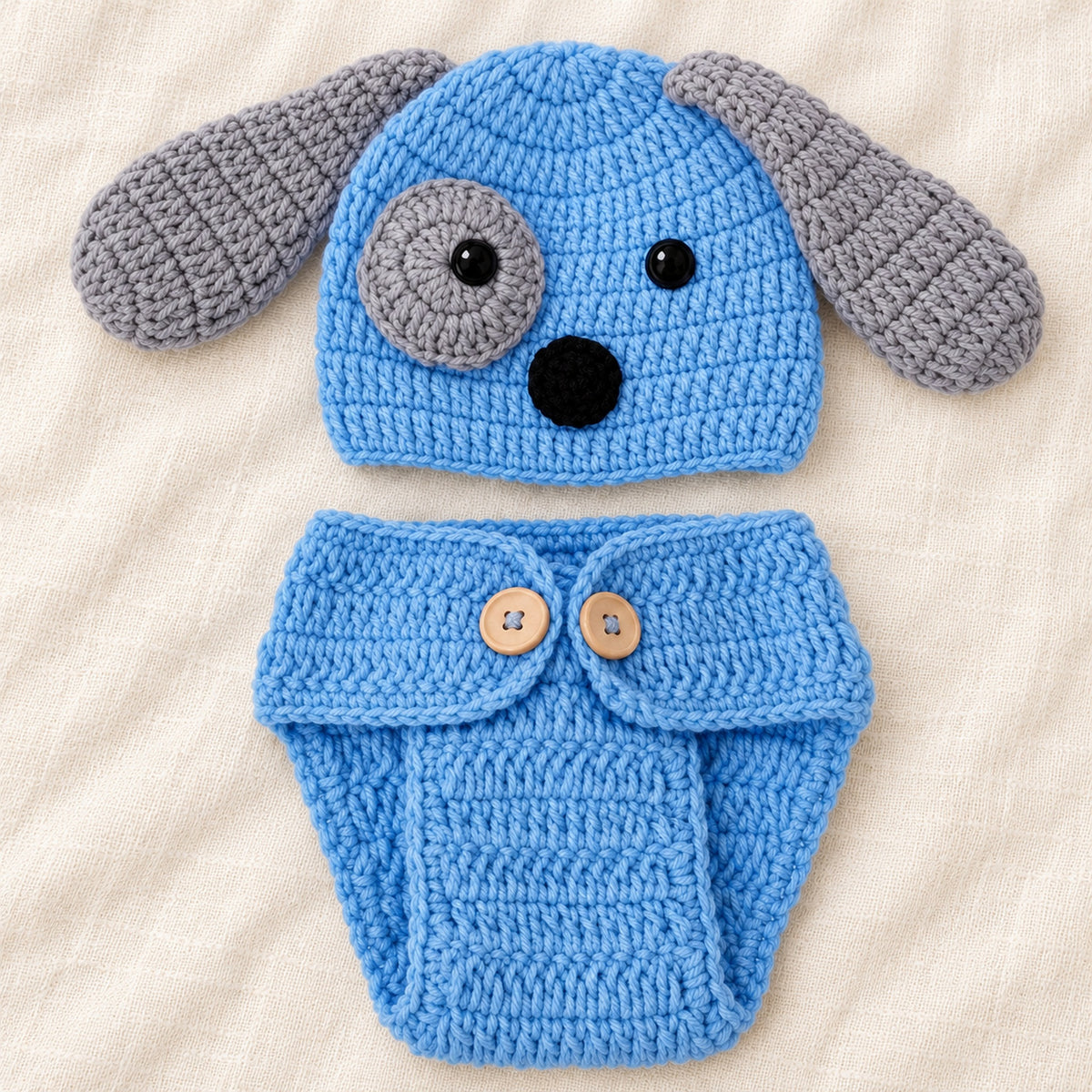 Close-up of the puppy hat's crochet stitches, floppy ear and eye patch