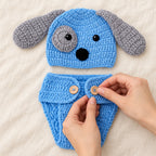 Adult fastening a diaper-cover waist button