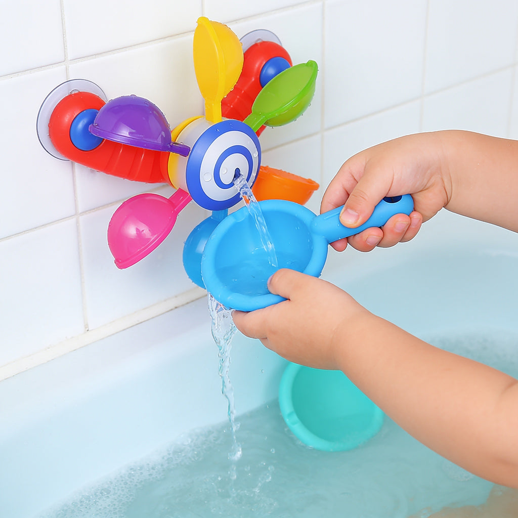 Lumiwee Ripple toddler bath toys: small hands pouring a scoop over the spinning windmill