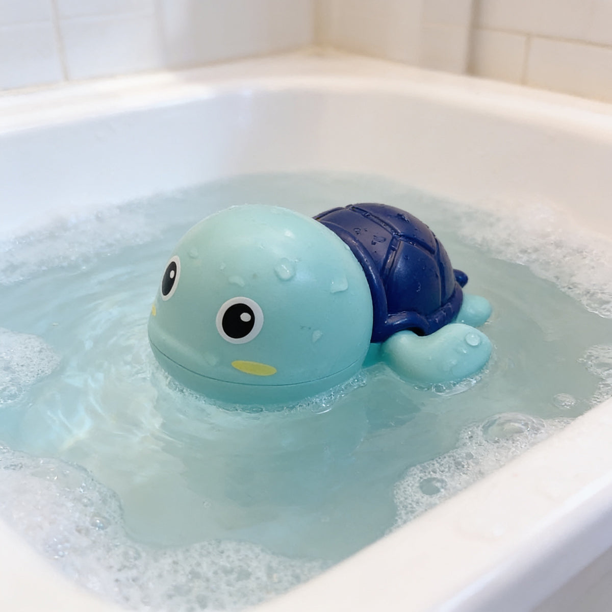 Lumiwee Ripple toddler bath toys, Blue Turtle Swimmer option, in a bright room