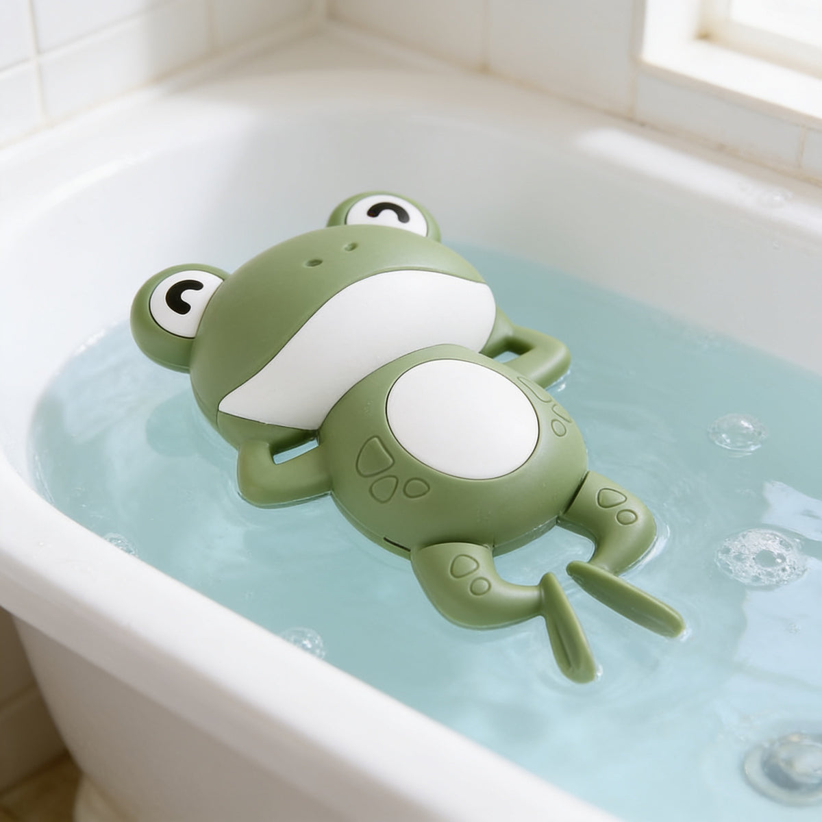 Lumiwee Ripple toddler bath toys, Green Frog Swimmer option, in a bright room
