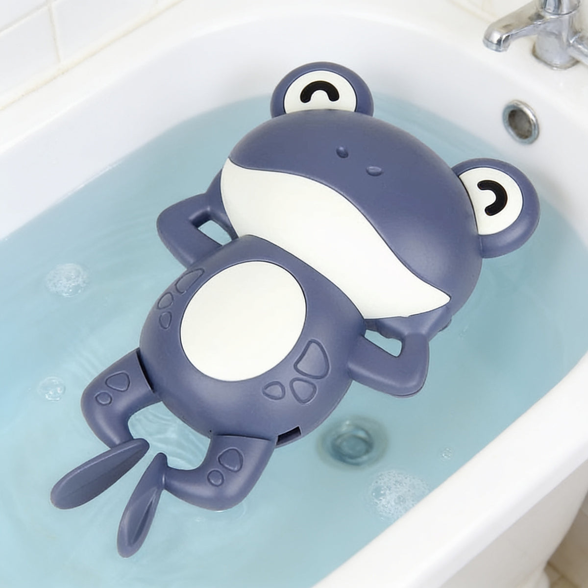Lumiwee Ripple toddler bath toys, Navy Frog Swimmer option, in a bright room