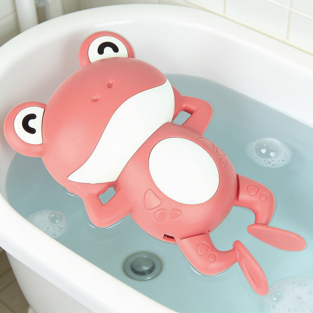 Lumiwee Ripple toddler bath toys, Pink Frog Swimmer option, in a bright room
