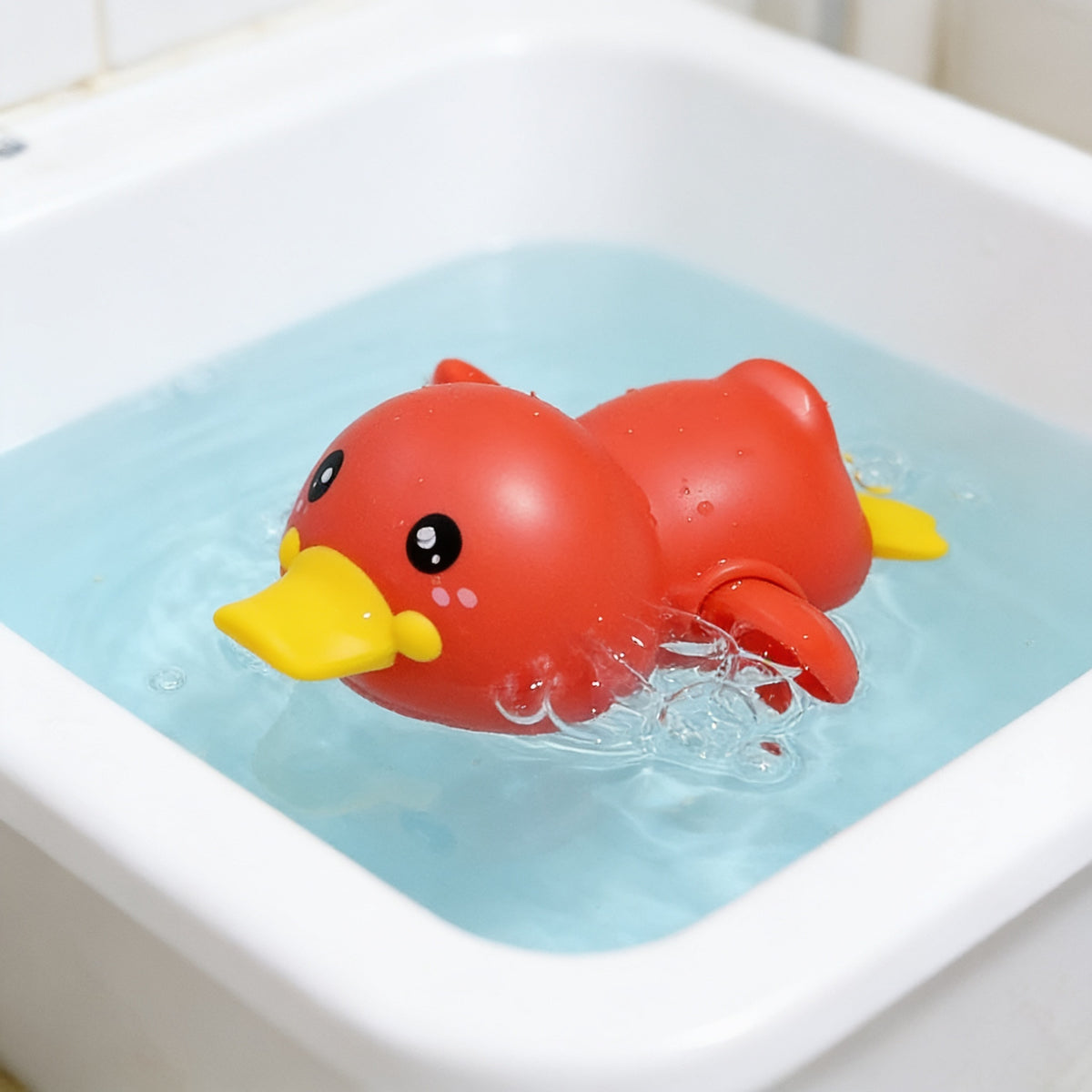 Lumiwee Ripple toddler bath toys, Red Duck Swimmer option, in a bright room