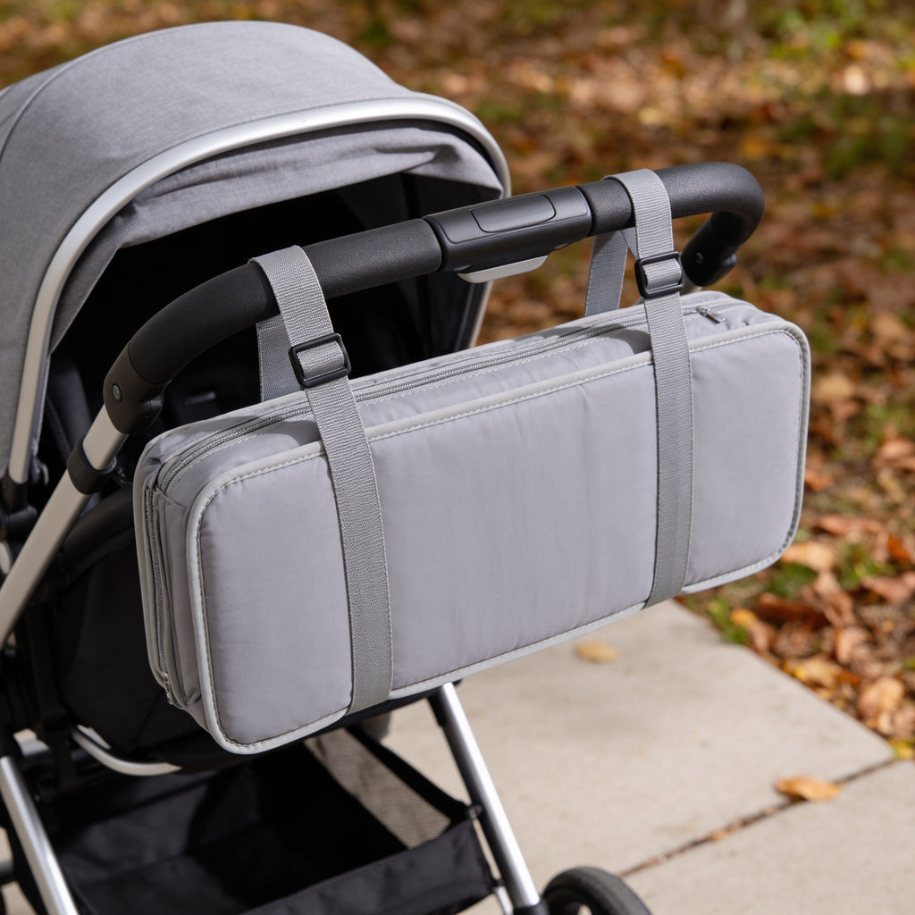 Lumiwee Robin portable changing pad: folded pad strapped to a stroller handle