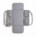 Lumiwee Robin portable changing pad: gray portable changing pad unfolded on a white background