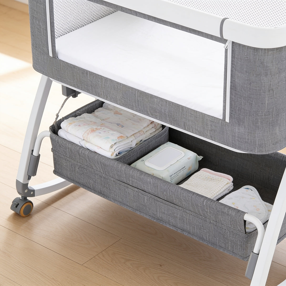 Lumiwee Rowan bedside baby crib: storage basket under the crib with diapers and wipes