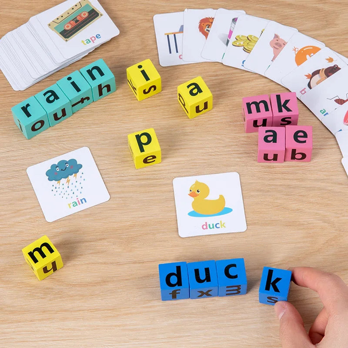 Lumiwee Scribble wooden letter blocks and word cards on an oak table