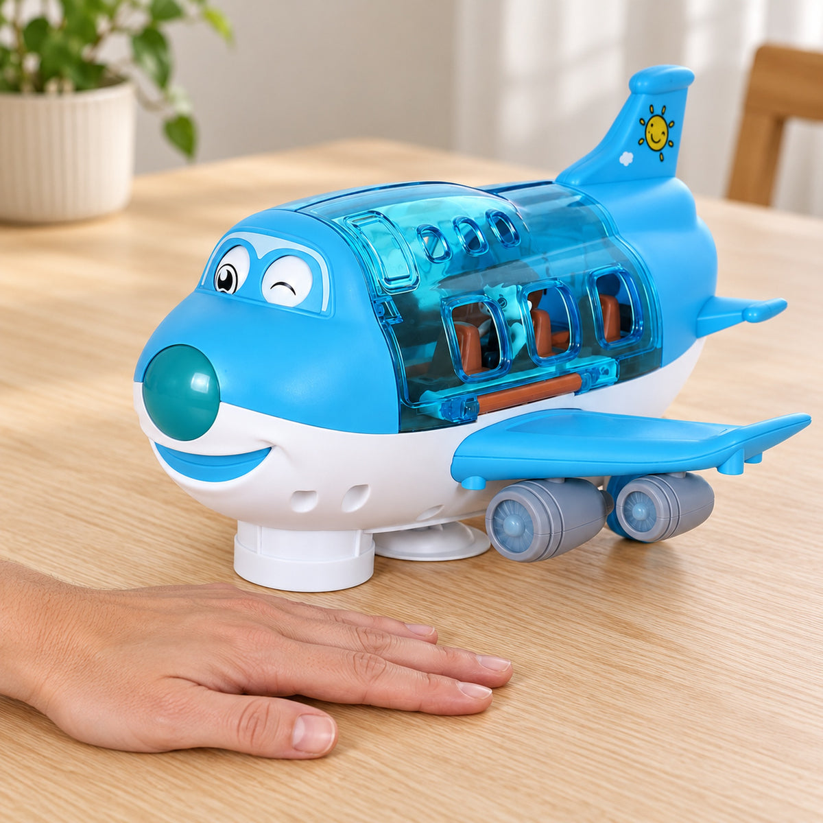 Lumiwee Skye airplane beside an adult hand for scale