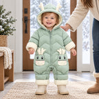 Lumiwee Sleet green hooded snowsuit worn by a standing toddler with a parent