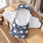 Lumiwee Snowy Polar Bear bunting wrap open on an entryway bench