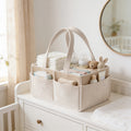 Lumiwee Sorrel corduroy diaper caddy basket: beige corduroy diaper caddy stocked with diapers and wipes on a nursery dresser