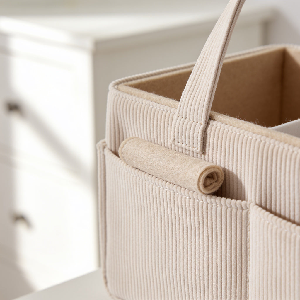 Lumiwee Sorrel corduroy diaper caddy basket: close-up of the corduroy ribs, handle stitching and felt divider
