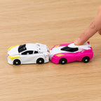 Adult finger pushing the pink car into the rear of the white car