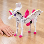 Sparkle assembled unicorn beside an adult hand for scale
