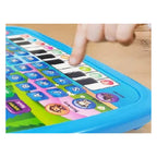 Finger pressing a piano key on the Sprout blue learning tablet